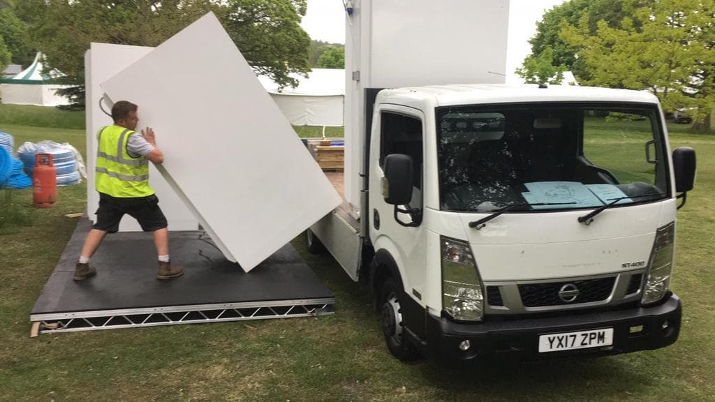 CMS team delivering shower units at an event